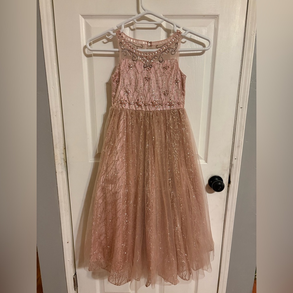 gorgeous dusty rose-colored sparkly dress with sweet bow detail on the back.